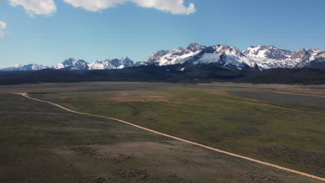 Orbiting-drone-shot-of-the-massive-Sawtooth-mountains-in-Idaho