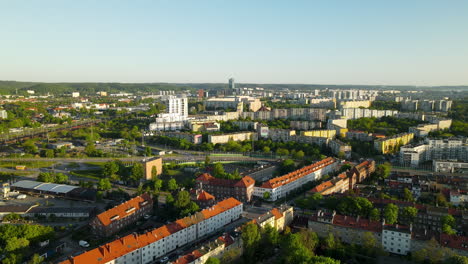 Drone-cityscape-panorama-at-the-old-town-and-modern-buildings-divided-with-highway-road-in-Gdansk,-Poland