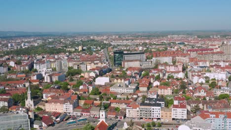 Novi-Sad,-Serbian-city-streets-and-buildings-on-summer-day,-4K-view-over-city