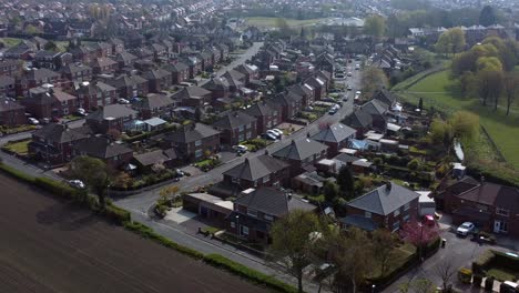 Lancashire-housing-estate-aerial-view-flying-above-England-farmland-residential-community-homes