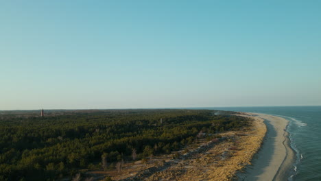 top-down-aerial-footage-over-Hel-Peninsula,-near-close-to-waterfront-and-forest,-Hel,-Poland