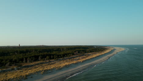 Aerial-view-of-peninsula-Hel-at-Baltic-sea-in-Poland,-drone-flying-along-the-coastline