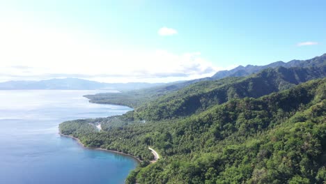 Aerial-View-Of-Green-Mountains-With-Ocean-View-At-Summer-In-Tropical-Island-Of-Philippines