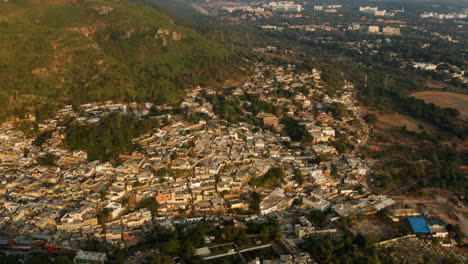 Panoramic-View-Of-Saidpur-Village-In-Islamabad,-Pakistan-At-Sunset---aerial-drone-shot