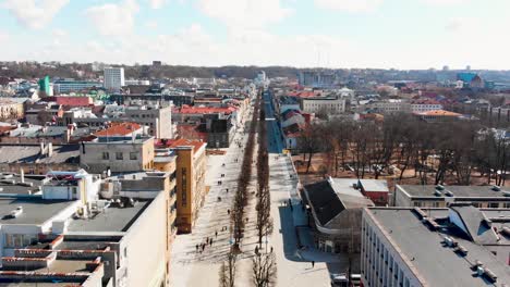 Aerial-footage-of-drone-flight-over-Laives-Aleja-pedestrian-street-in-Kaunas,-Lithuania-on-a-sunny-day