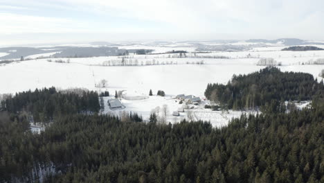 Aerial-Shot-Of-Czech-Republic-Camp-In-Beautiful-Winter-Nature-Landscape,-Wood-Cabin-Accommodation