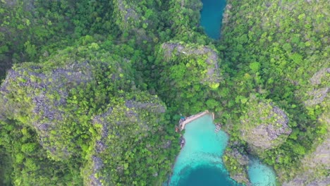 Aerial-view-of-beautiful-karst-scenery-and-turquoise-ocean-waters-in-Coron,-Palawan,-Philippines