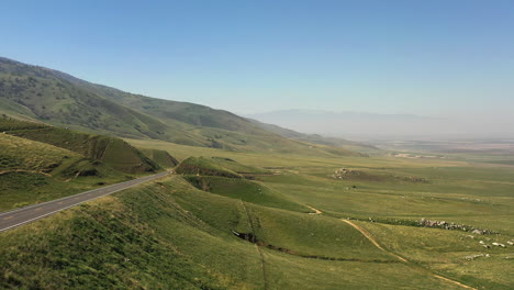 Aerial-flight-along-an-empty-road-along-the-foothills-of-the-Tehachapi-Mountains