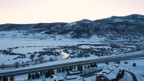 A-Beautiful-Small-River-as-the-Sun-Rises-Down-The-Snowscape-Steamboat-Ski-Resort-In-Steamboat-Springs,-Colorado