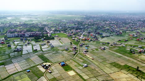 Cinematic-flying-over-rice-paddies-in-the-countryside-Bhairahawa,-Nepal