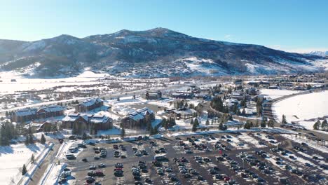 Aerial-View-Of-Full-Parking-Lot-at-Steamboat-Springs-Ski-Resort-In-Colorado-At-Winter