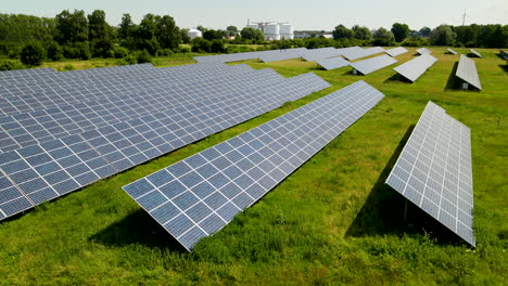 Sunny-aerial-truck-shot-of-solar-panels-in-industrial-renewable-green-energy-farm