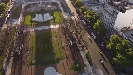 Aerial-forward-over-Congress-Square-at-sunset,-Buenos-Aires