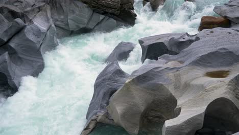 Epic-slow-motion-of-a-magical-creek-with-glacier-water,-Norway