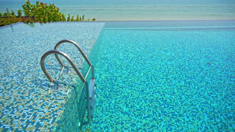 Steps-in-Crystal-Clear-Blue-Outdoor-Swimming-Pool-near-Beach