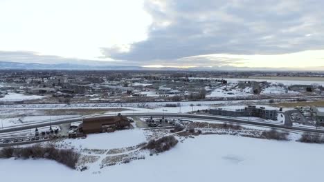 AERIAL---Drone-pulls-back-revealing-small-town-on-overcast-day