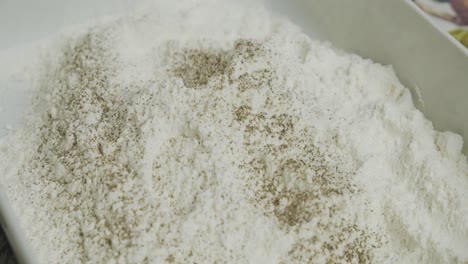 Adding-spice-into-cooking-flour