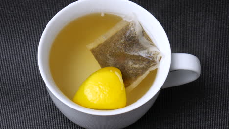 Hot-green-tea-mug,-drink,-beverage,-healthy-fresh-lemon-herbal-tea-in-cup,-teacup,-antioxidant,-caffeine,-detox