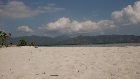 Timelapse-shot-of-sandy-beach-of-tropical-Gili-Air-Island-during-sunlight