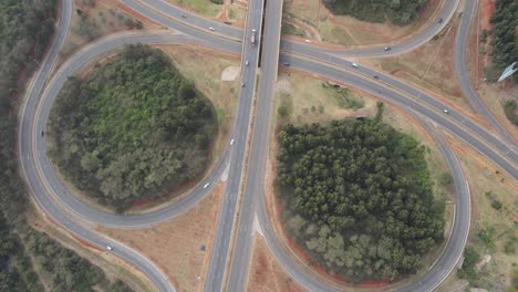 Top-view,-circular-intersection-on-Nairobi-Southern-Bypass-Highway,-aerial-dolly