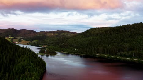 Lake-Between-Green-Mountain-Forest-At-Sunset-In-Norway