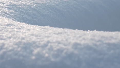 Crystal-clear-snow-dunes-in-macro-camera-motion-shot