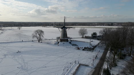 High-jib-up-of-traditional-windmill-in-rural-snow-covered-landscape