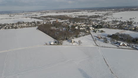 Stunning-aerial-of-Dutch-rural-town-in-winter