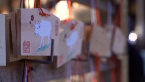 Slow-tracking-typical-wooden-wishing-cards-at-Japanese-shrine-low-depth-of-field