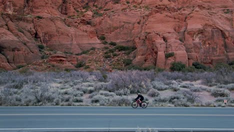 Slow-motion-of-cyclist-on-asphalted-road-in-Snow-Canyon-State-Park
