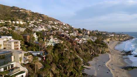 Aerial-view-at-dusk-in-Laguna-Beach,-California,-wide-dolly-left-shot