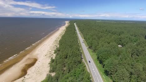 High-aerial-view-of-the-road-and-beach-of-Rozkalni-in-Latvia