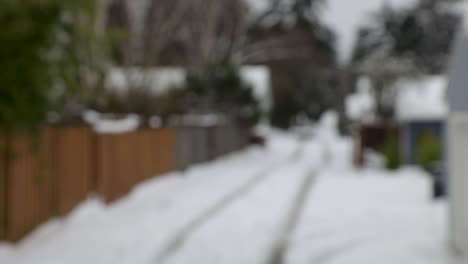 Slow-motion-shot-of-person-with-gloves-throwing-snowball-in-the-air-and-catching