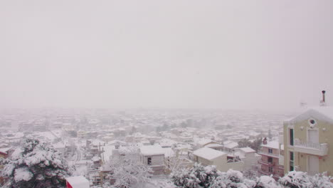 Athens-Greece-rare-Medea-blanket-snow-cover-across-neighbourhood-suburb-residential-district-skyline-panning-right