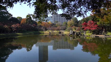 Slow-push-in-towards-beautiful-Japanese-landscape-garden-and-skyscrapers-in-Tokyo