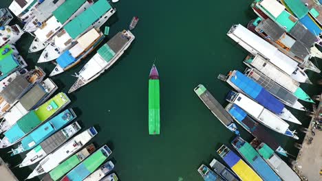 Aerial-view-above-boats,-at-the-Labuan-Bajo-marina,-Flores,-Indonesia---Overhead,-drone-shot
