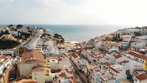 Picturesque-houses-of-Carvoeiro-resort-town-and-beach,-Algarve