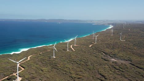 Drone-shot-of-a-windmills,-on-the-coast-of-Albany,-Australia---trucking,-aerial-view