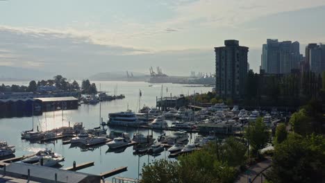 Drone-Aerial-Shot-Over-the-Vancouver-Marina,-Sliding-Closer-to-the-Cityscape-Skyscrapers-Canada