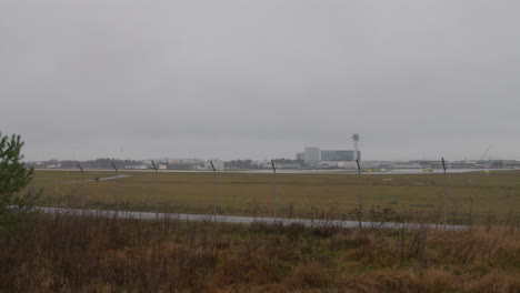 Slow-wide-pan-of-the-Arlanda-airport-on-a-cloudy-and-rainy-day-in-Stockholm