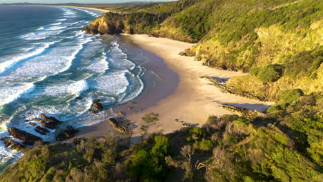 Cinematic-revealing-drone-shot-of-Broken-Head-coast-near-Byron-Bay