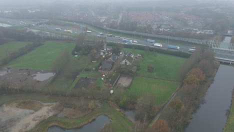 Aerial-overview-of-farm-located-next-to-busy-highway