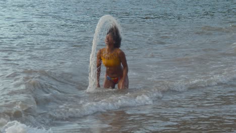 Epic-slowmotion-of-a-girl-rising-out-of-the-ocean-with-her-hair-creating-an-amazing-halo-with-the-water