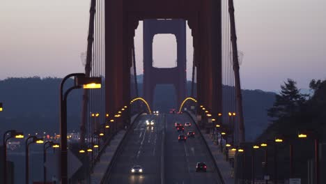Close-Up-Shot-of-Cars-Driving-Across-Golden-Gate-Bridge-in-San-Francisco-on-a-Early-Morning