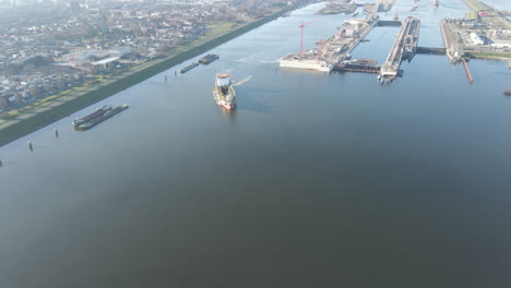 Aerial-of-large-ship-turning-near-the-world's-largest-ship-lock
