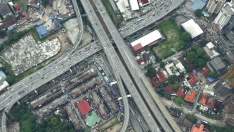 Aerial-Shot-Of-Traffic-Driving-On-Busy-Expressway-in-Kuala-lumpur,-Malaysia