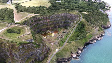 Aerial-Orbit-of-Abandoned-Berry-Head-Limestone-Quarry-in-Brixham,-Devon,-UK