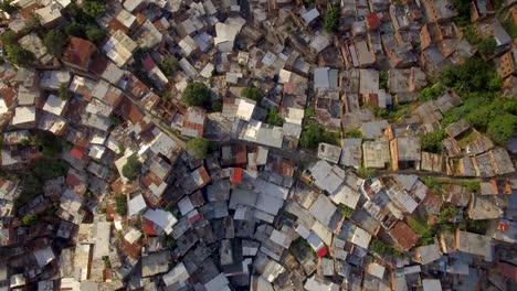 Birds-eye-view-of-Petare-slum,-in-Caracas,-Venezuela,-during-a-sunset