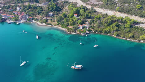 Sailboats-moored-in-Adriatic-Sea-Croatia,-high-aerial-view