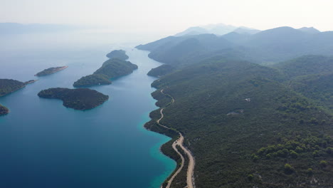Adriatic-sea-coastal-road,-Croatia,-sunny-aerial-view